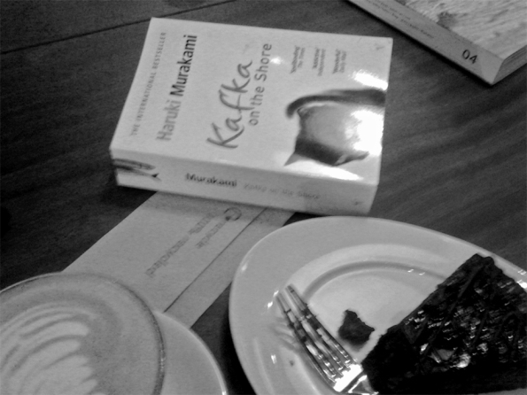 Murakami's 'Kafka On the Shore' with my cake. What I was originally reading (and which the woman behind the cashier desk gave two thumbs up to!)
